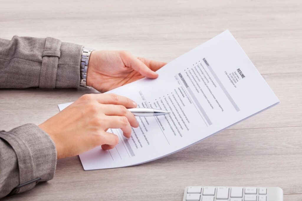 person with resume in hand